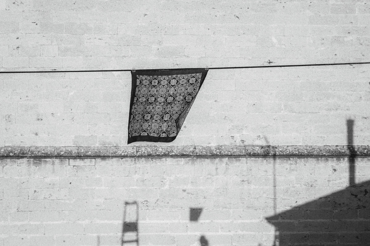 A block-printed fine silk scarf, draped